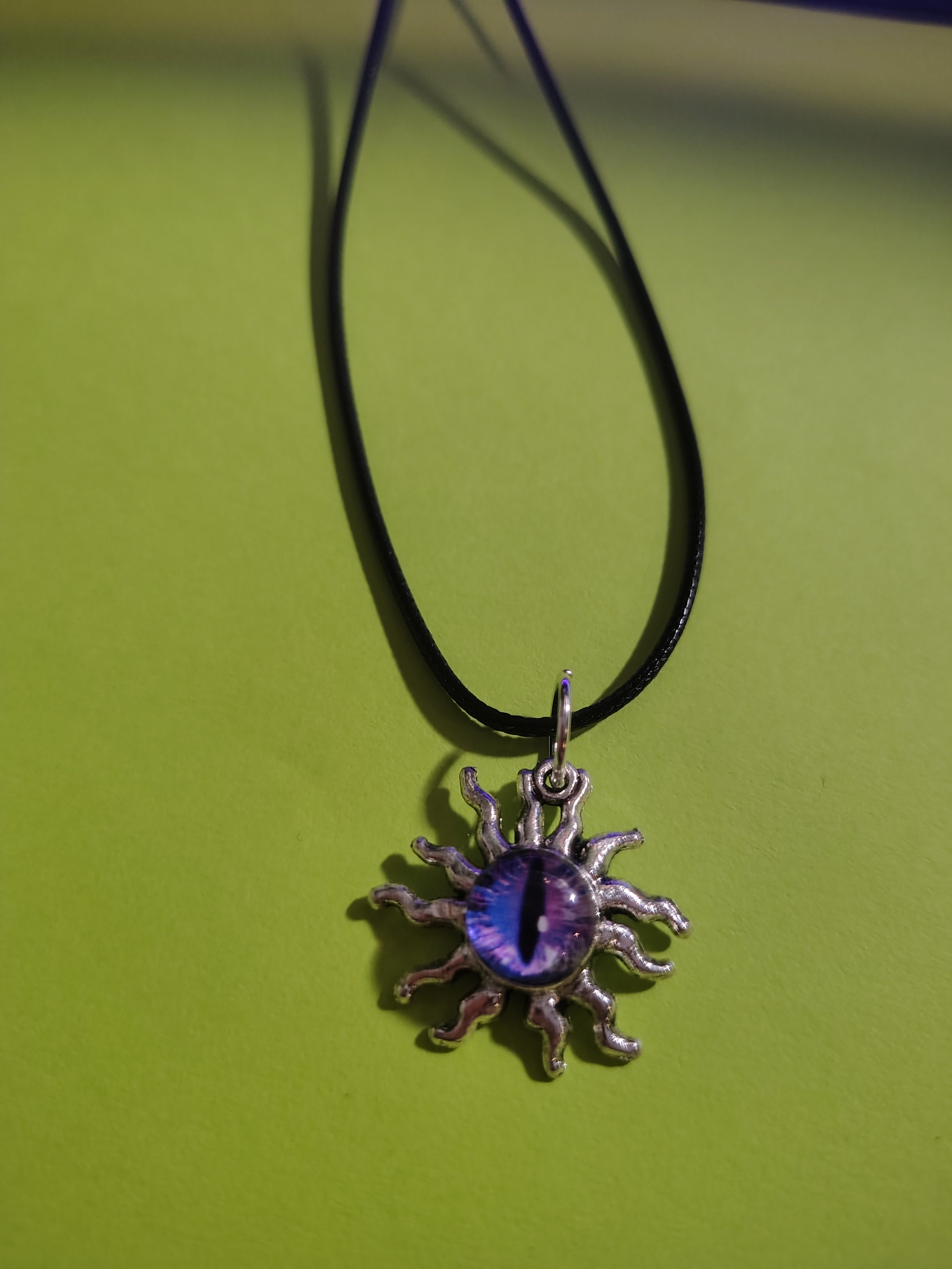 Sunwatcher™ — Purple Eye Sun Pendant