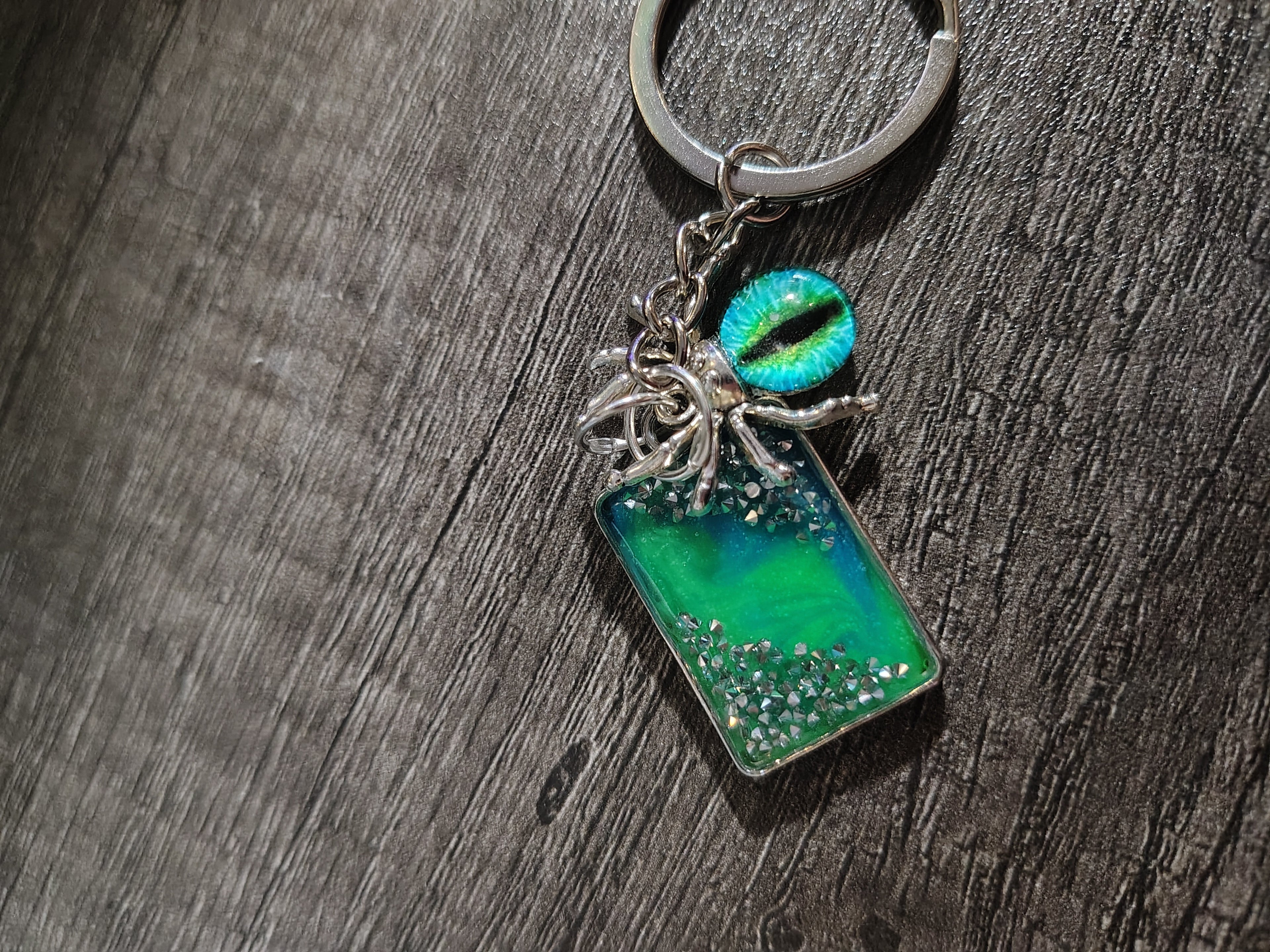 Veilwatcher™ — Emerald Spider Eye Glow Keychain