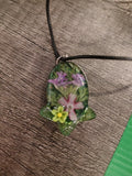 VeilBloom™ Sunflower Garden Pendant — round gold bezel with preserved sunflower, yellow cord