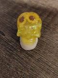 Yellow resin mini skull with sunflower charms and gold glitter - front view