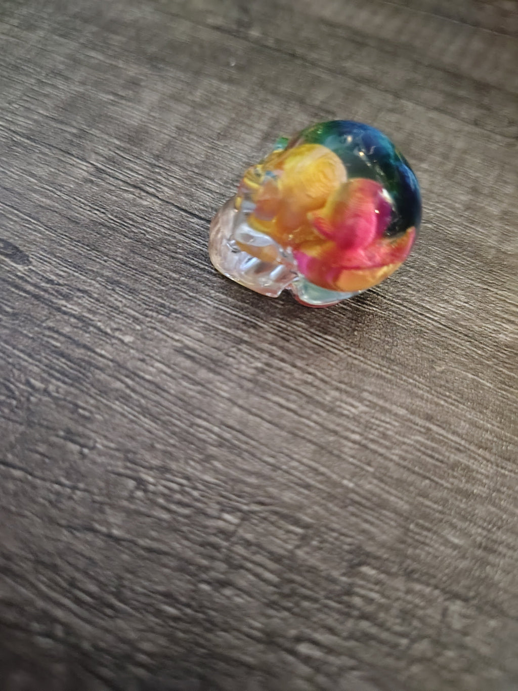 Clear rainbow resin mini skull with rubber duckies - back view