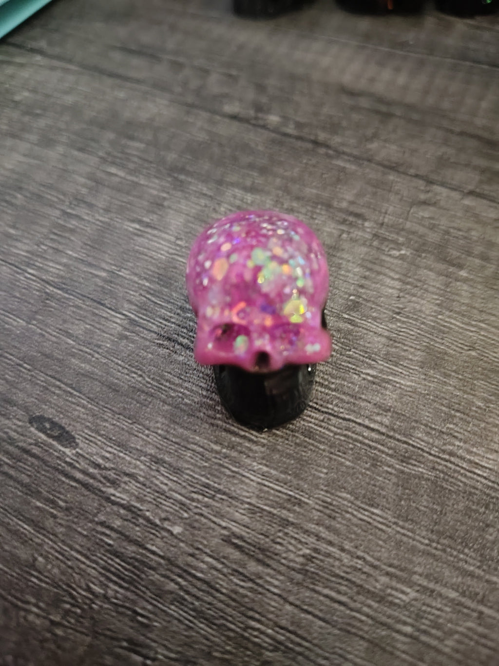 Pink feather holographic glitter mini skull with black jaw - front view