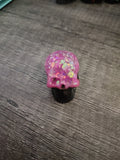Pink feather holographic glitter mini skull with black jaw - front view