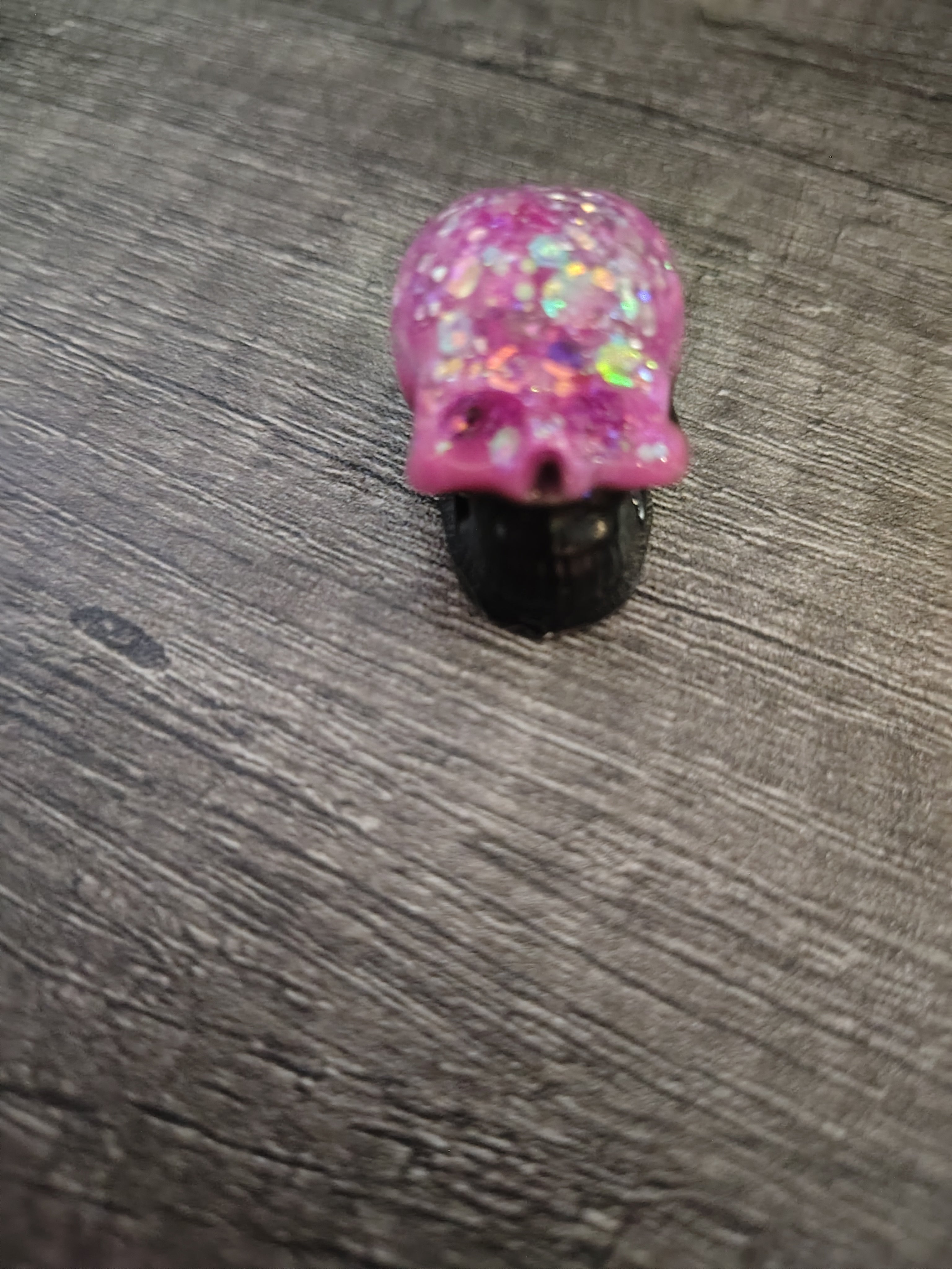 Pink feather holographic glitter mini skull with black jaw - back view