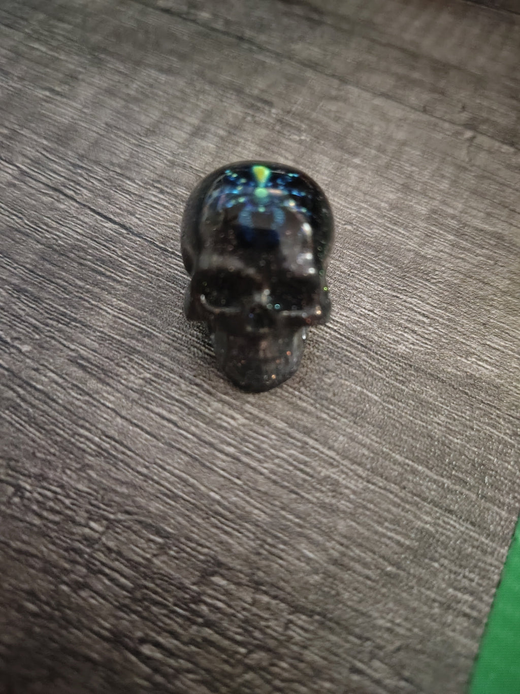 Black iridescent glitter mini skull with green shimmer spider - front view