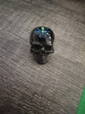 Black iridescent glitter mini skull with green shimmer spider - front view