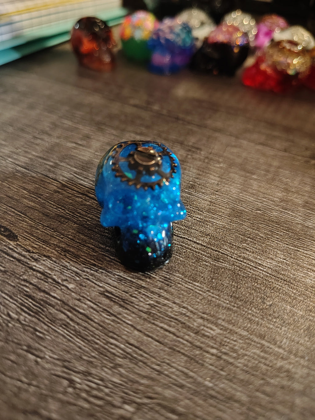 Electric blue steampunk mini skull with bronze gears - side view