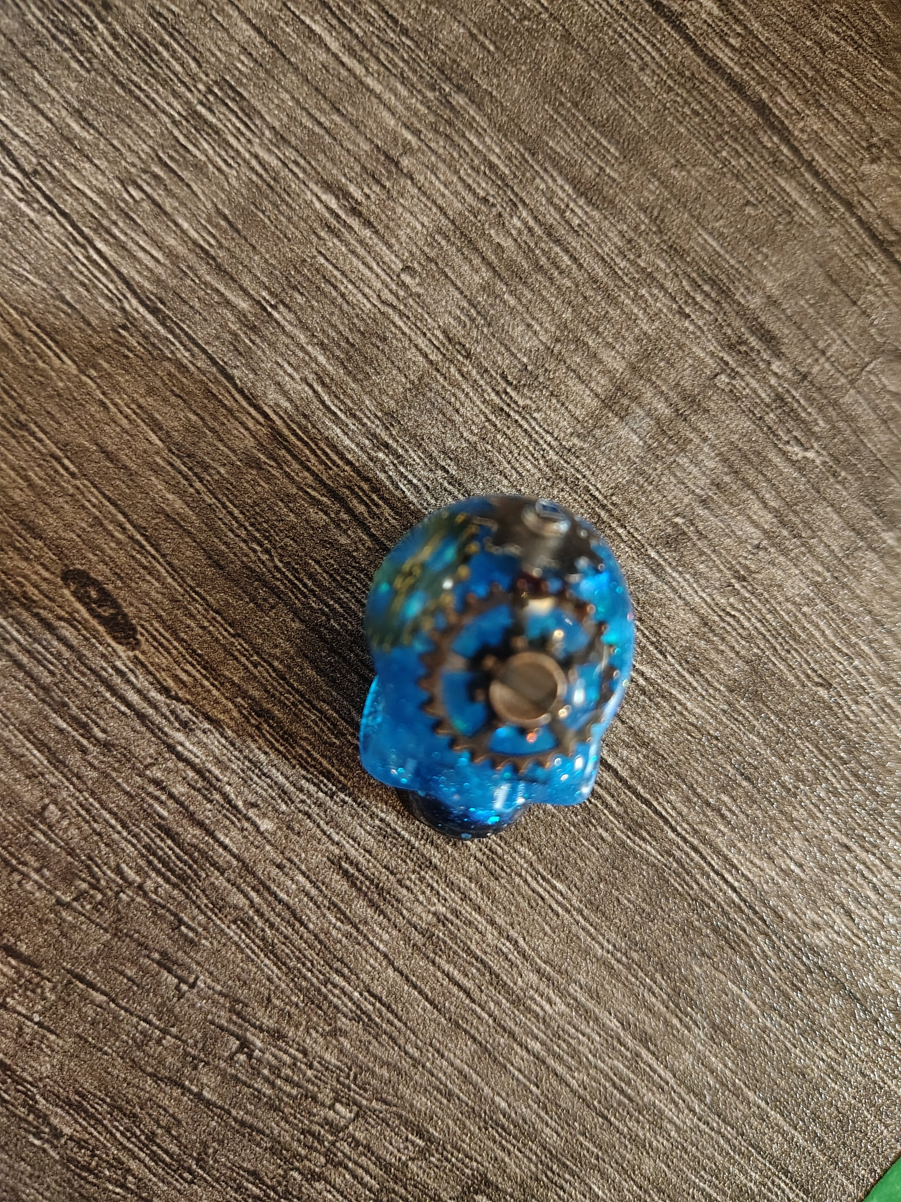 Electric blue steampunk mini skull with bronze gears - top view