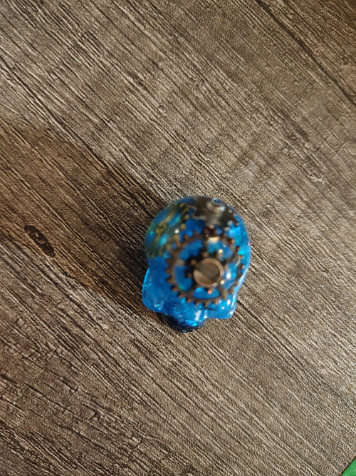 Electric blue steampunk mini skull with bronze gears - top view