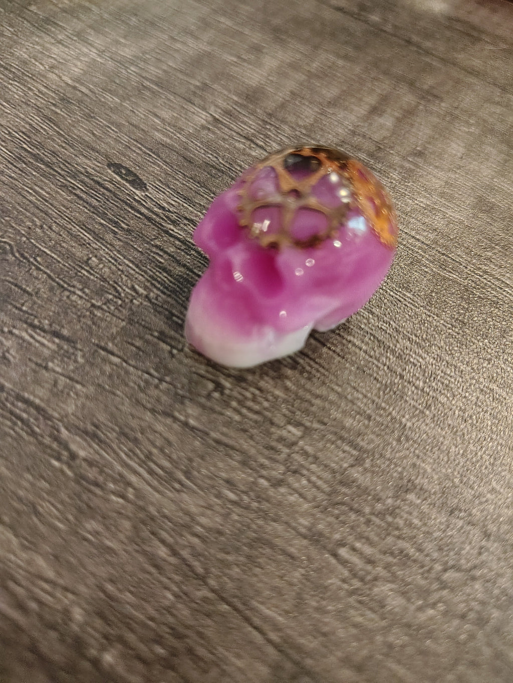 Pink steampunk mini skull with bronze gears and white jaw - front view