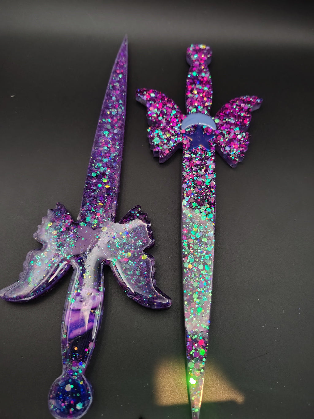 Realm Blades™ - purple glitter winged sword pair close up