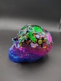 Large sequin-filled resin skull with purple to blue jaw - side view