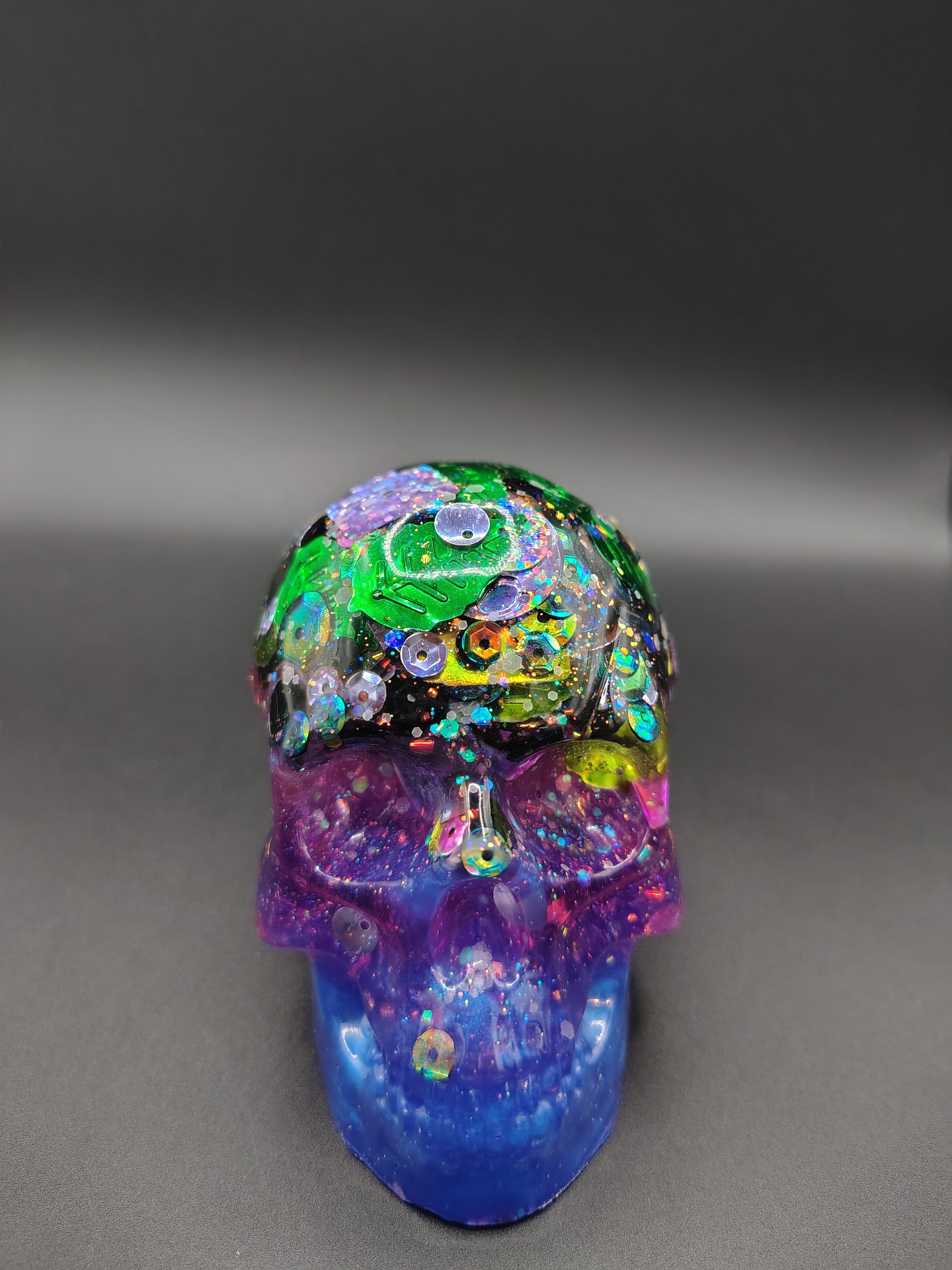 Large sequin storm resin skull - front view showing purple to blue fade