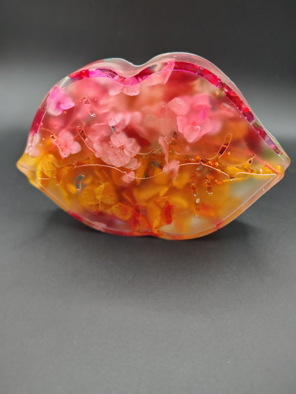 Bloom Kiss™ - clear resin lip sculpture with preserved pink and orange flowers front view