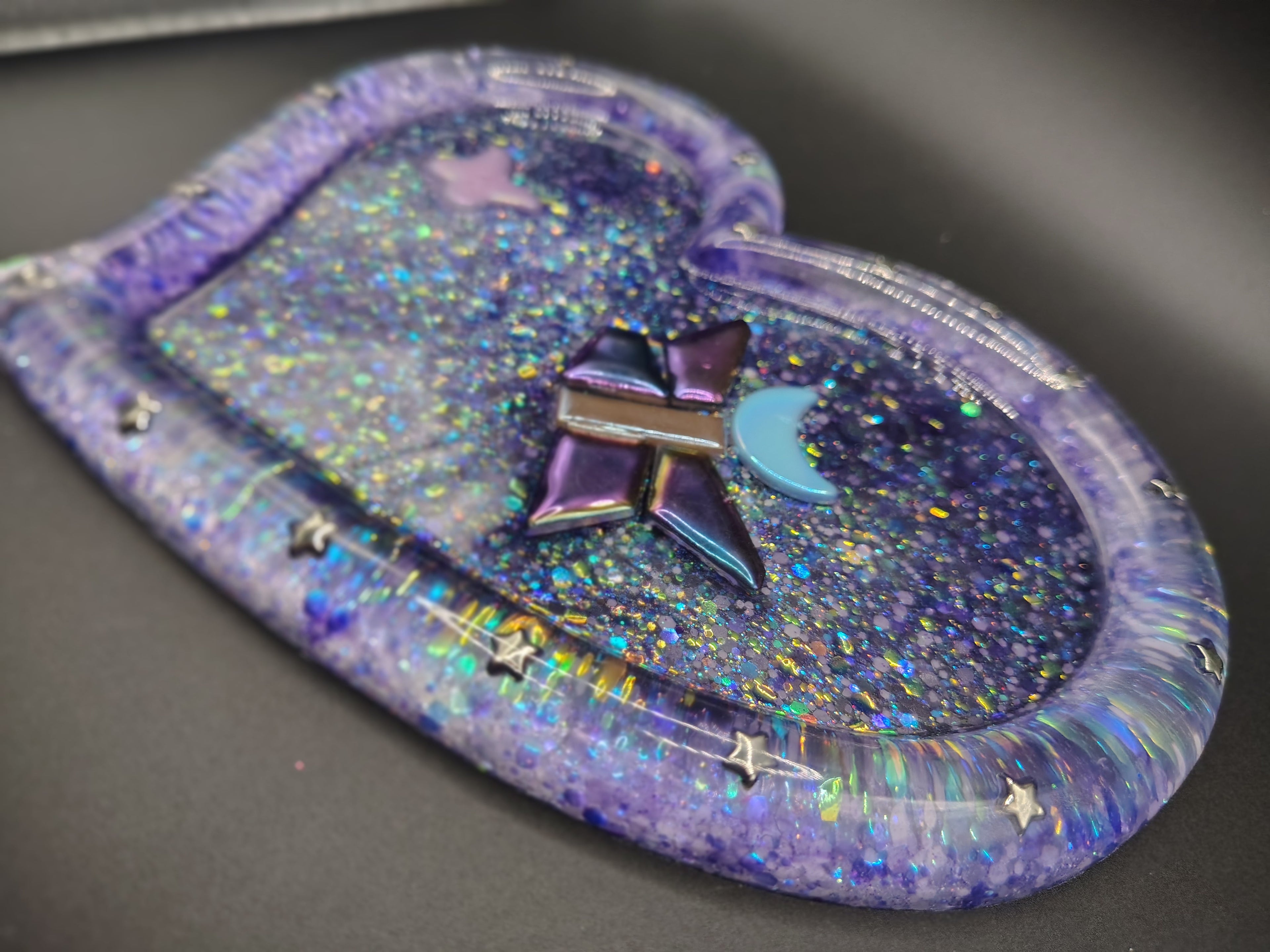 Heart-shaped purple Loomlight glitter tray - side angle showing rainbow shimmer and star charms